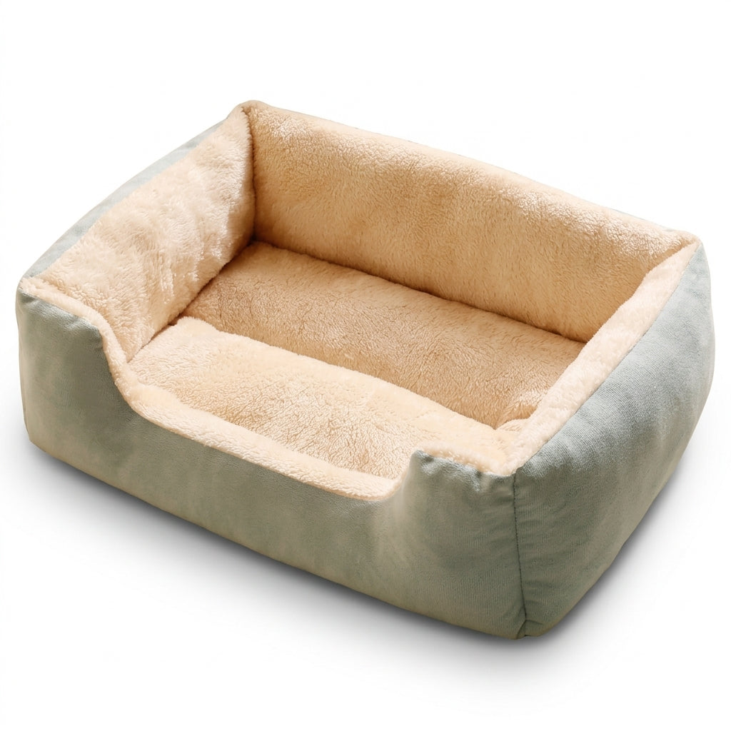 Rectangular basket bed for cats in sage green suede-look fabric with a cream plush lining and a low front edge