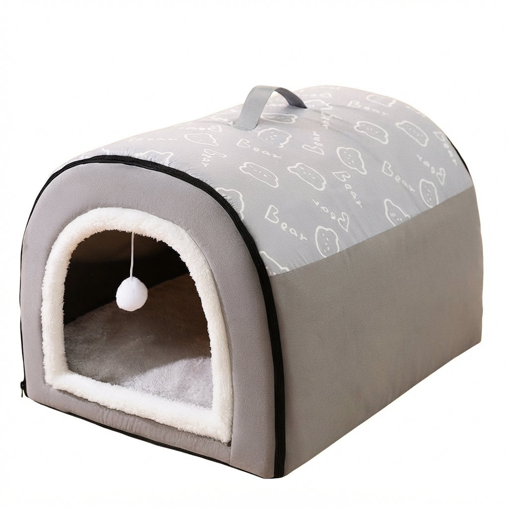 Grey bed house for dogs with a white bear doodle print on the roof, a fleece-lined doorway and a hanging pompom