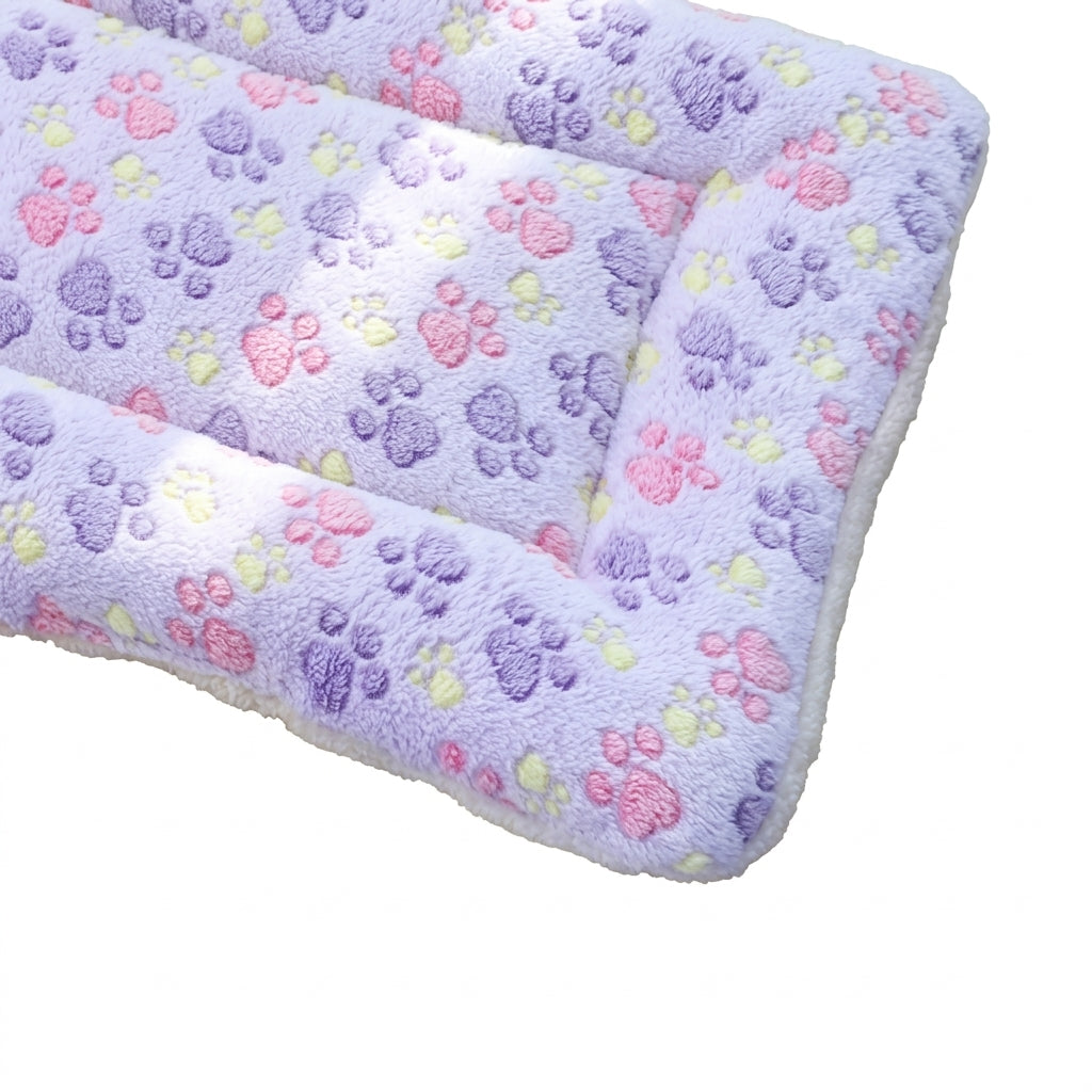 Padded fleece blanket bed in lilac paws with purple, pink and yellow paw prints and a cream underside