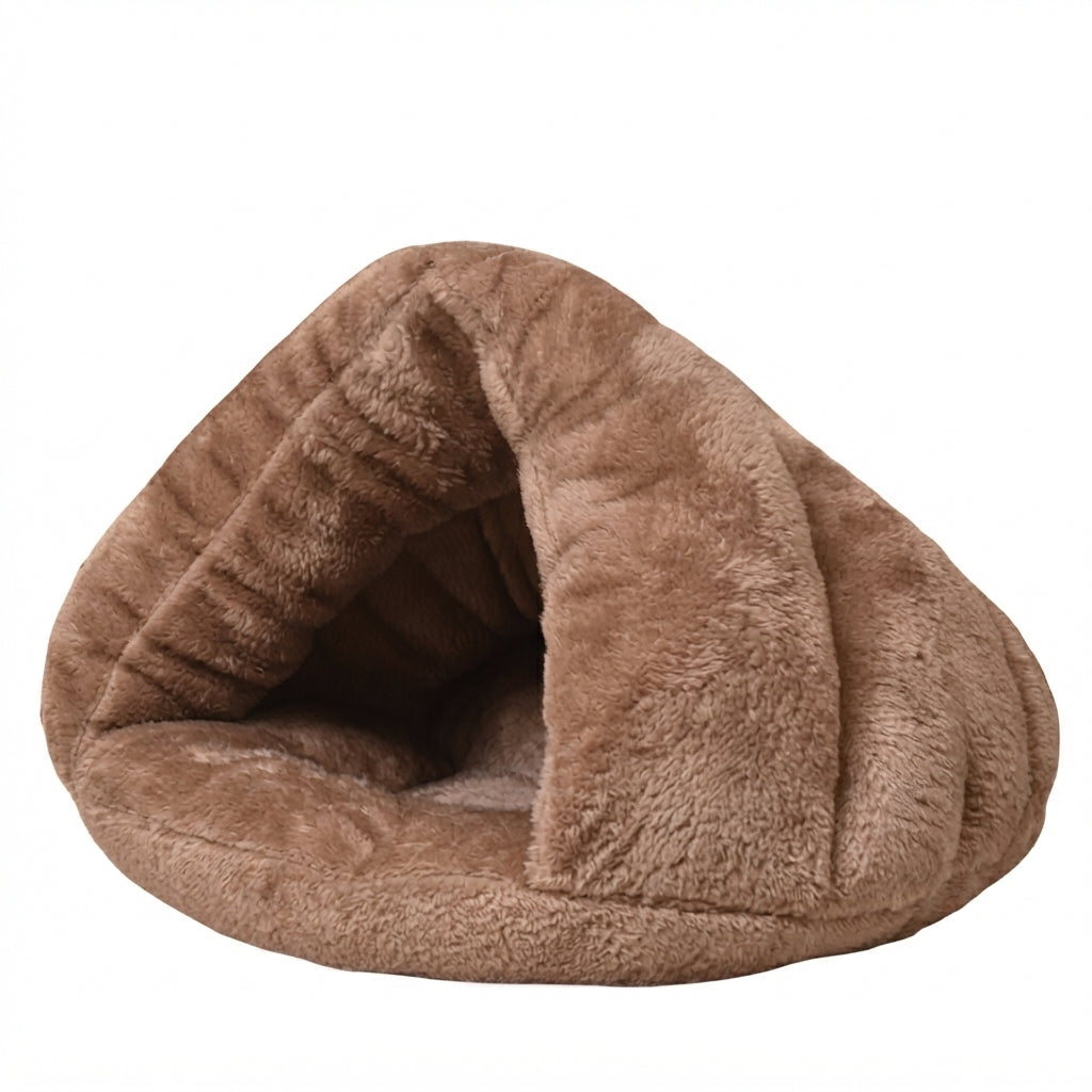 Burrow dog bed in camel brown plush, a pointed triangle cave with a rolled front edge