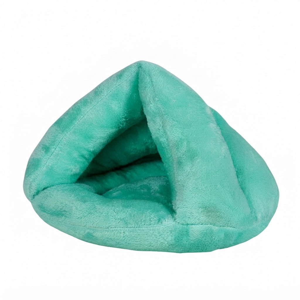 Burrow dog bed in mint green plush, a triangular cave with a padded floor and a deep front opening