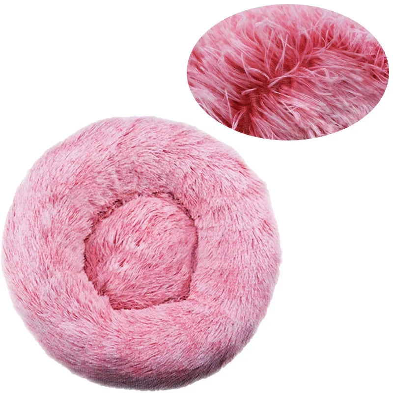 Donut dog bed in frosted pink plush, with an inset close-up of the deep pink roots and pale tips