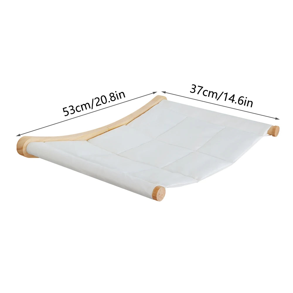 Cream quilted canvas wall hammock between two wooden bars, 53 cm (20.8 in) long and 37 cm (14.6 in) wide