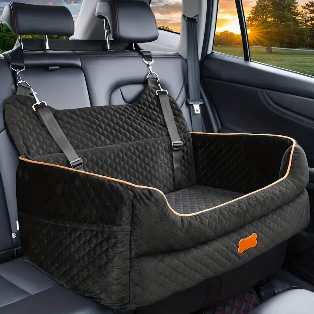 Black quilted dog car booster seat with tan piping, hooked to the headrests on the back seat of a car