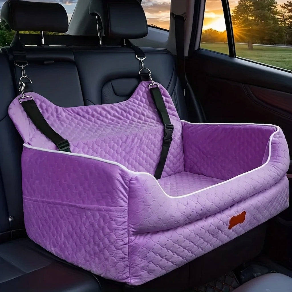 Purple quilted dog car booster seat with white piping, hooked to the headrests on the back seat of a car