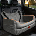 Car dog bed for large dogs in grey quilted fabric with orange piping, strapped to the headrests of a car back seat