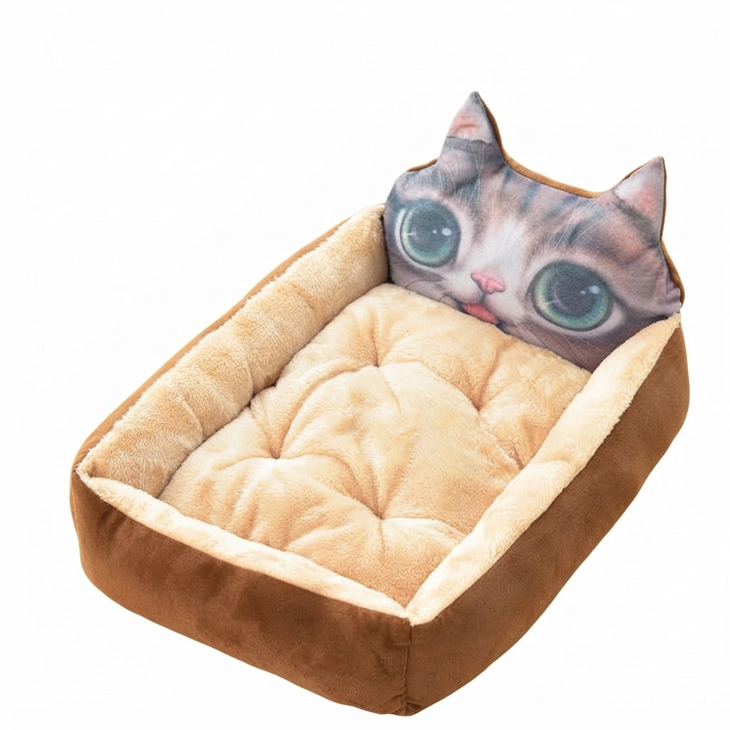 Cartoon pet bed with a printed big-eyed tabby cat face, brown sides and a beige tufted cushion