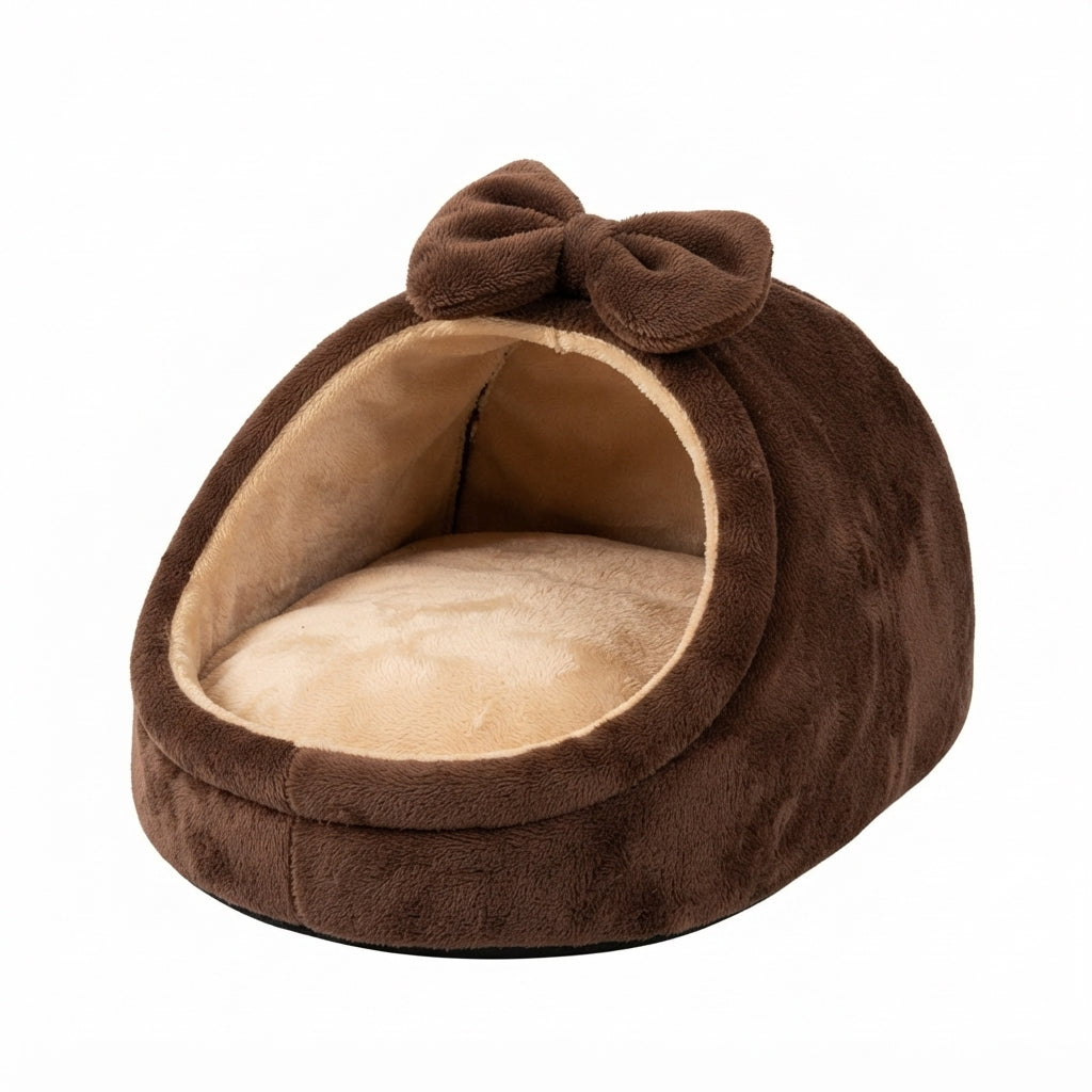 Covered cat bed with a bow in chocolate brown plush, a half-hooded nest with a beige lining and cushion