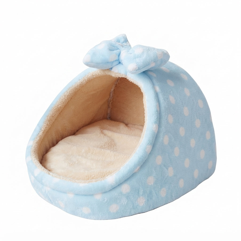 Covered cat bed with a bow in sky blue dots: pale blue plush with white spots and a beige cushion