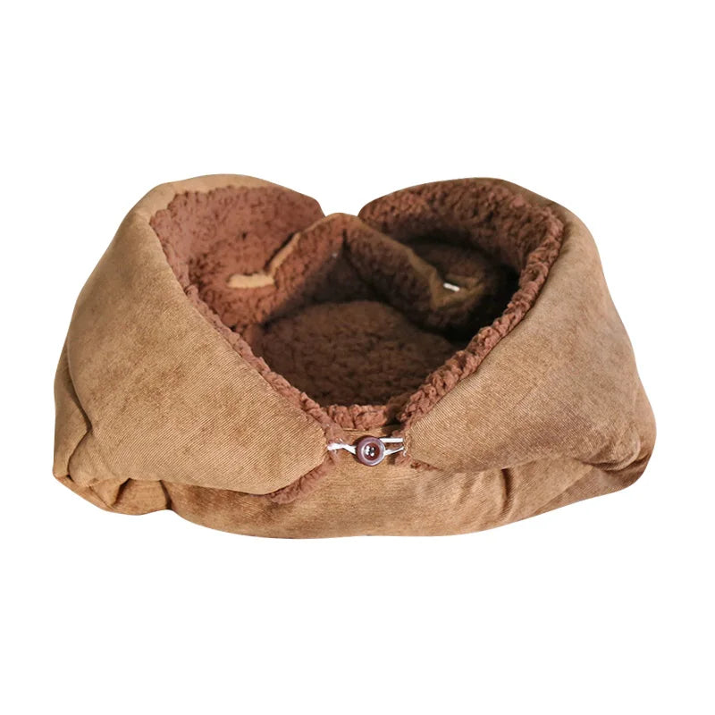 Cat cushion bed in coffee with a tan outer and a dark brown sherpa lining, buttoned up into a round nest