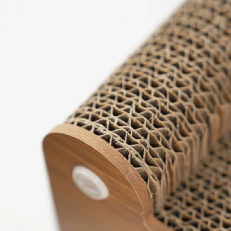 Close-up of the corrugated cardboard edge of the scratch top, set in a wood-effect side panel with a round white fixing