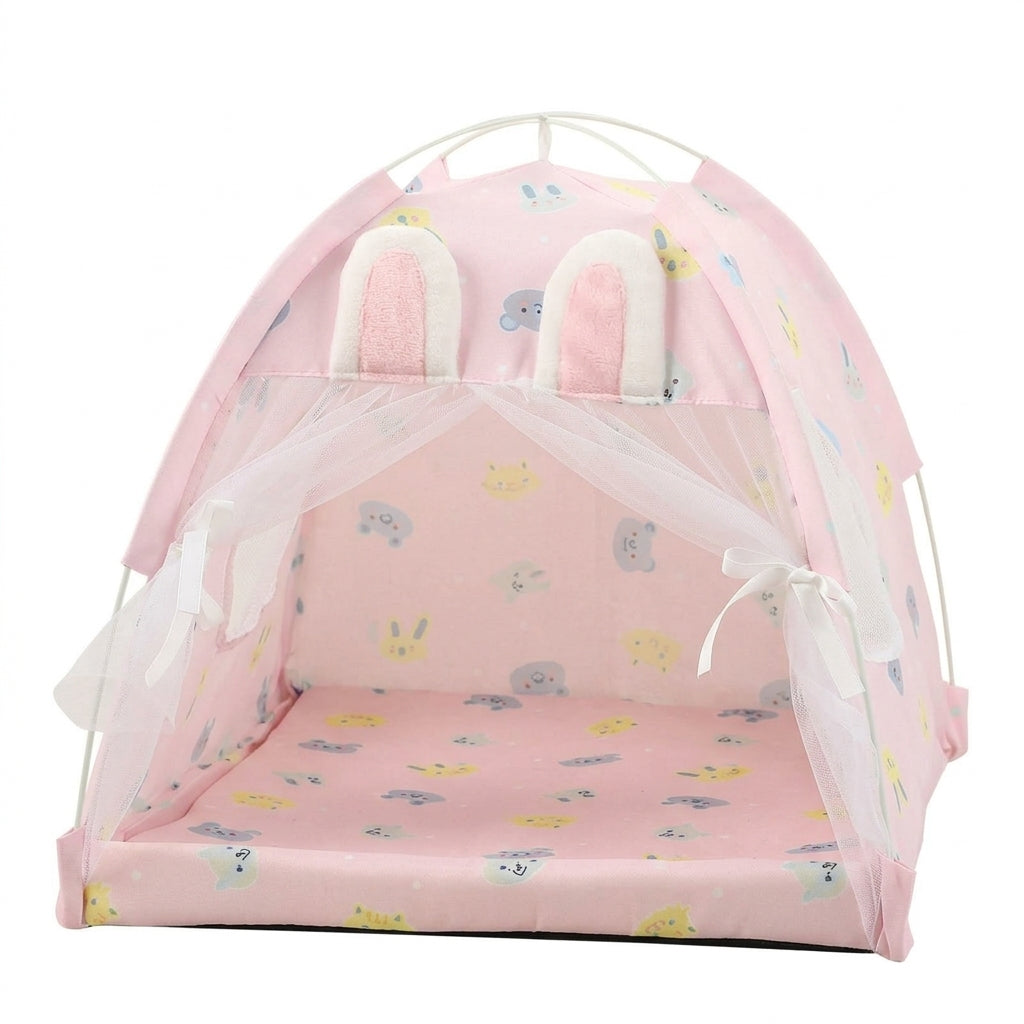 Cat tent bed in pale pink with bunny ears on top, a cartoon animal print and white lace curtains tied back