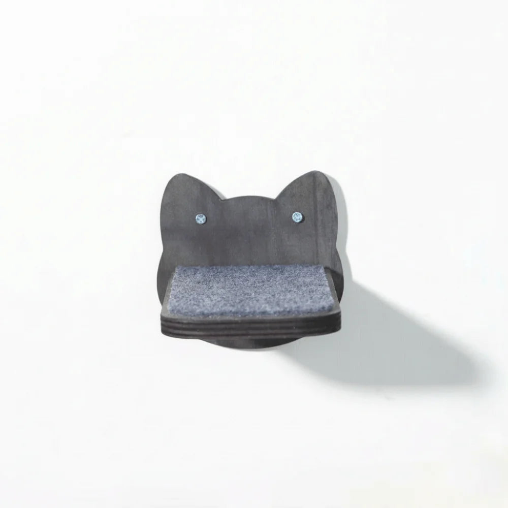 Cat wall step in black-stained wood, a cat-face back plate with a grey felt pad, seen from the front