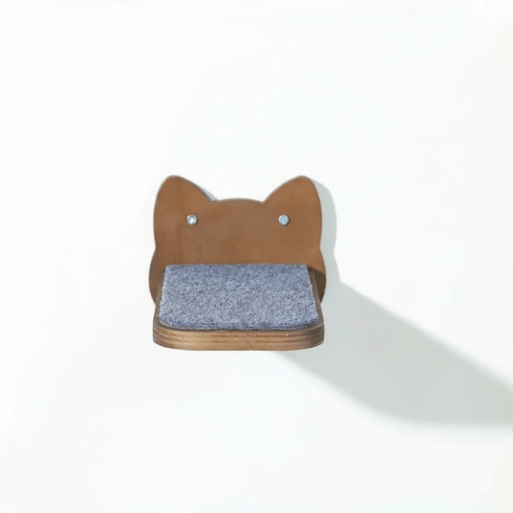 Cat wall step in brown wood, a cat-face back plate with a grey felt pad, seen from the front