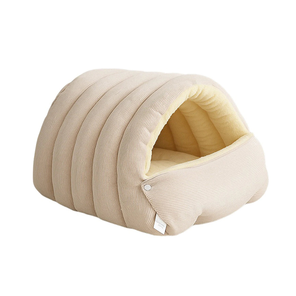 Corduroy cave dog bed in beige with ribbed padded panels, a pale yellow fleece lining and a snap-button front flap