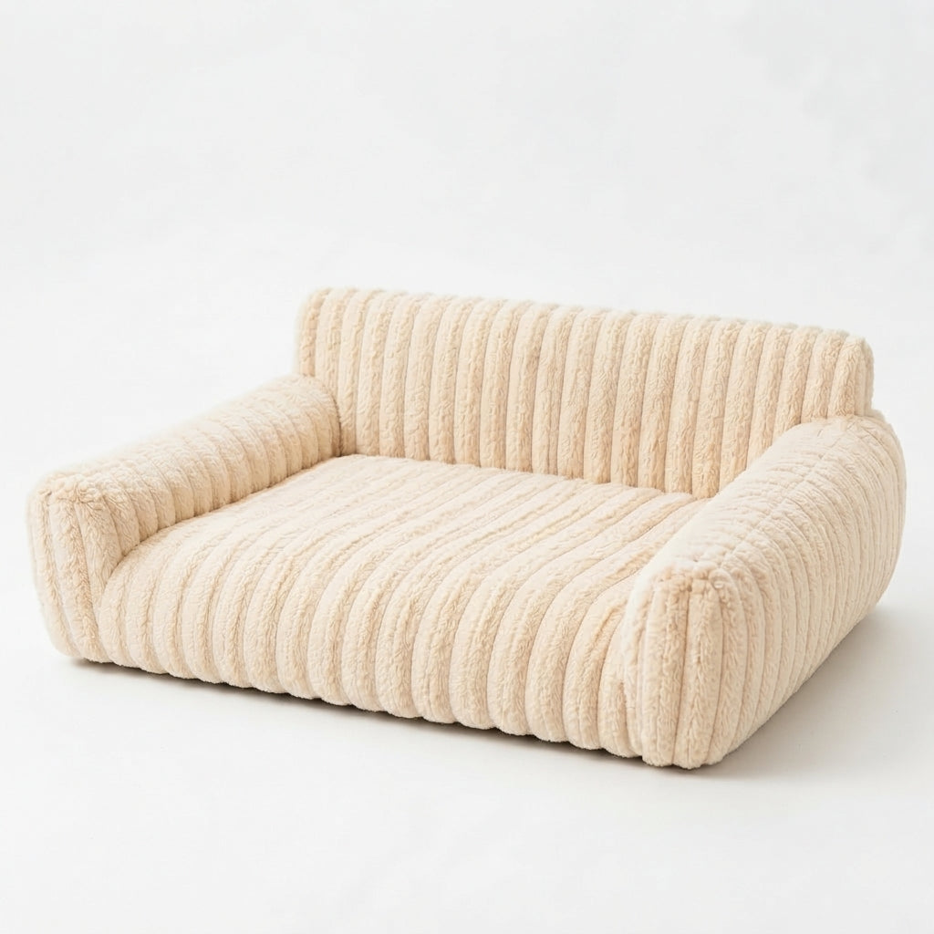 Corduroy couch bed for dogs in cream ribbed plush, with a low back and two rounded armrests
