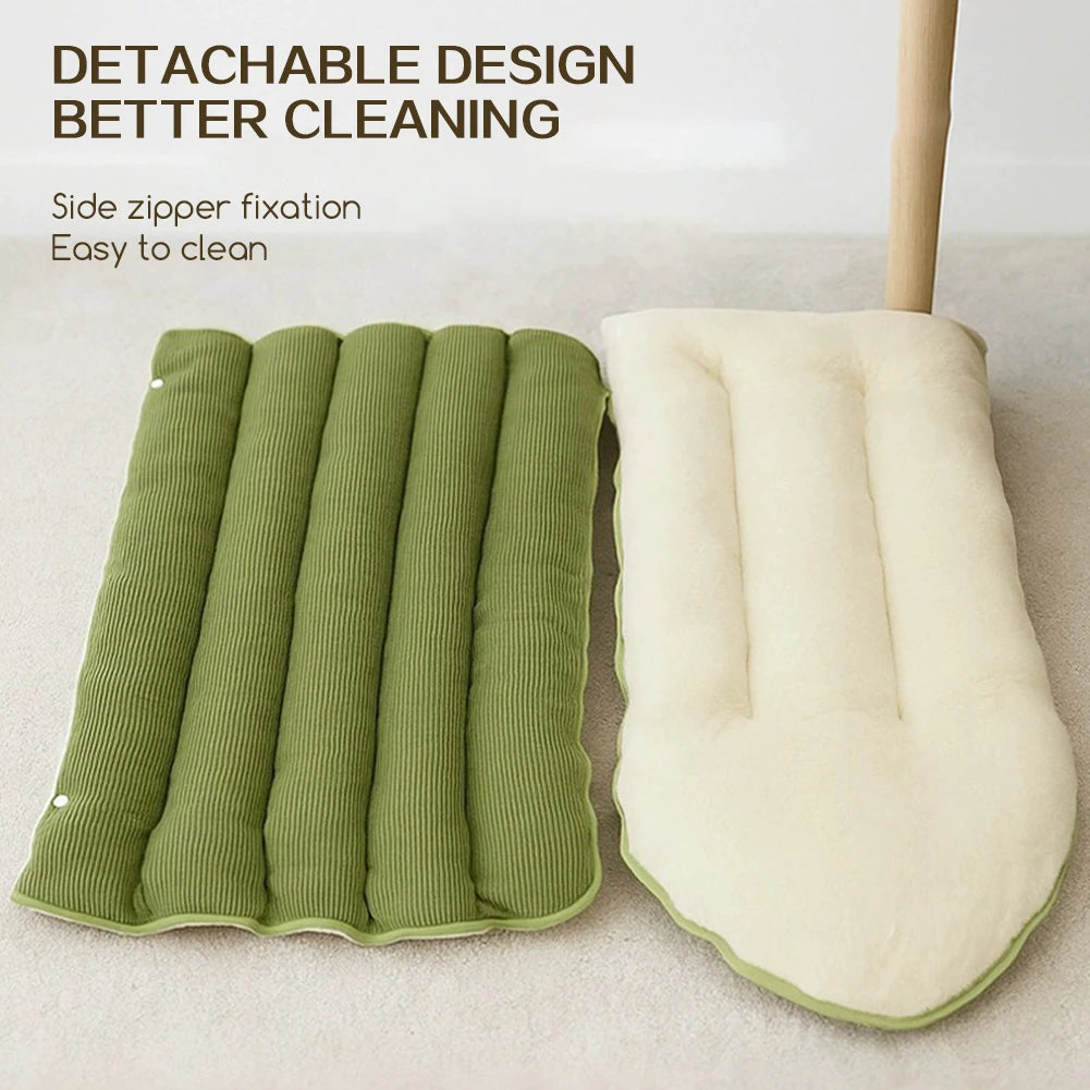 Green corduroy dog bed opened out flat beside its cream fleece cushion, with a caption about the removable zipped cover