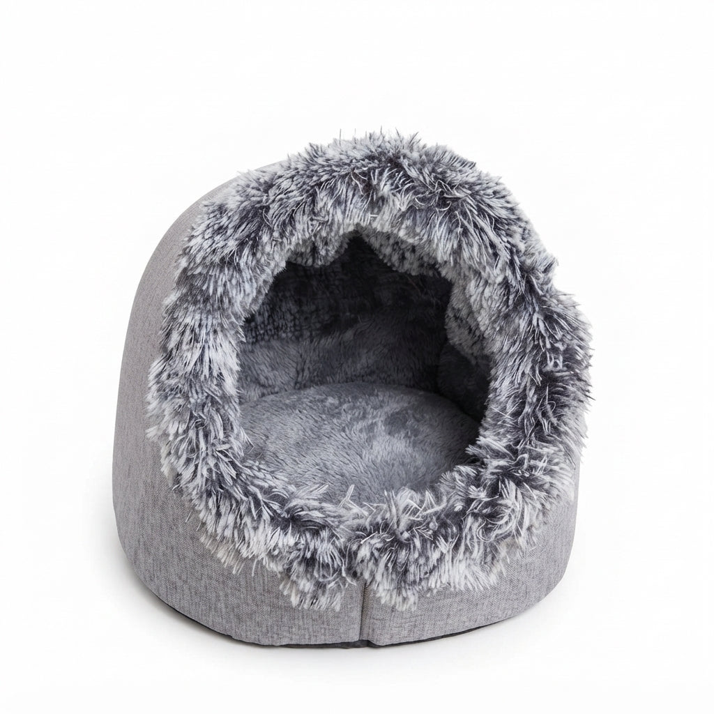 Grey covered cat bed seen from the front, with a shaggy grey and white rim and a soft grey cushion inside