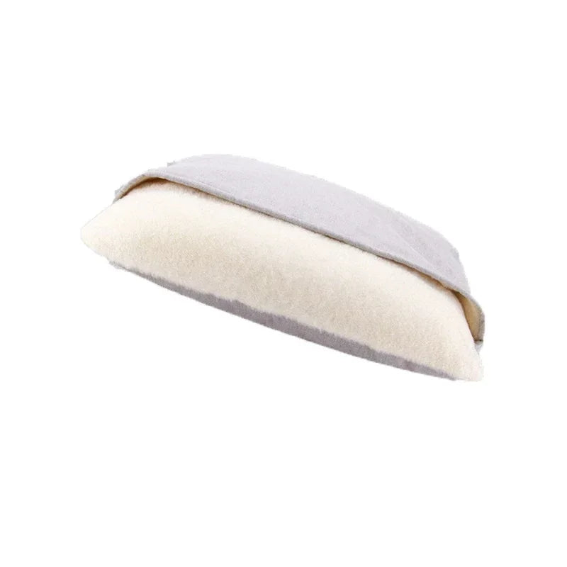 Dog bed cave in light grey linen look fabric with a cream sherpa pillow tucked under the top flap