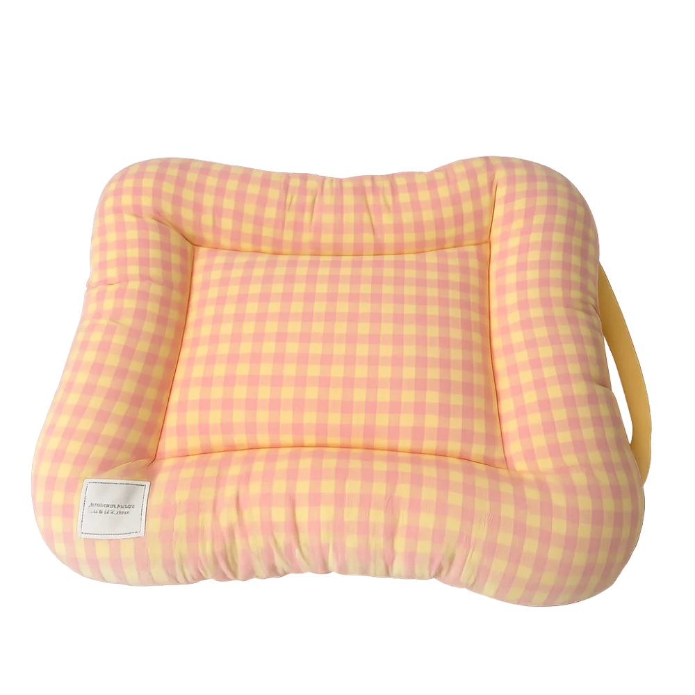 Dog bed cushion in peach and yellow gingham, a padded rectangle with a raised rim and a yellow carry strap
