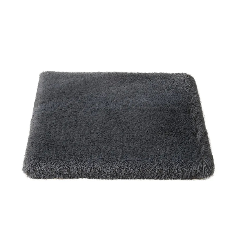 Dog bed mattress in dark grey with a dense long plush cover, a flat rectangular pad on a white background