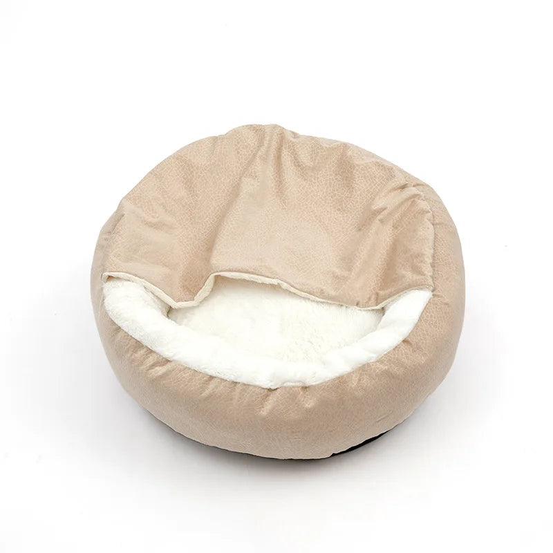 Round beige hooded bed with the built-in blanket pulled over, showing the white plush lining underneath