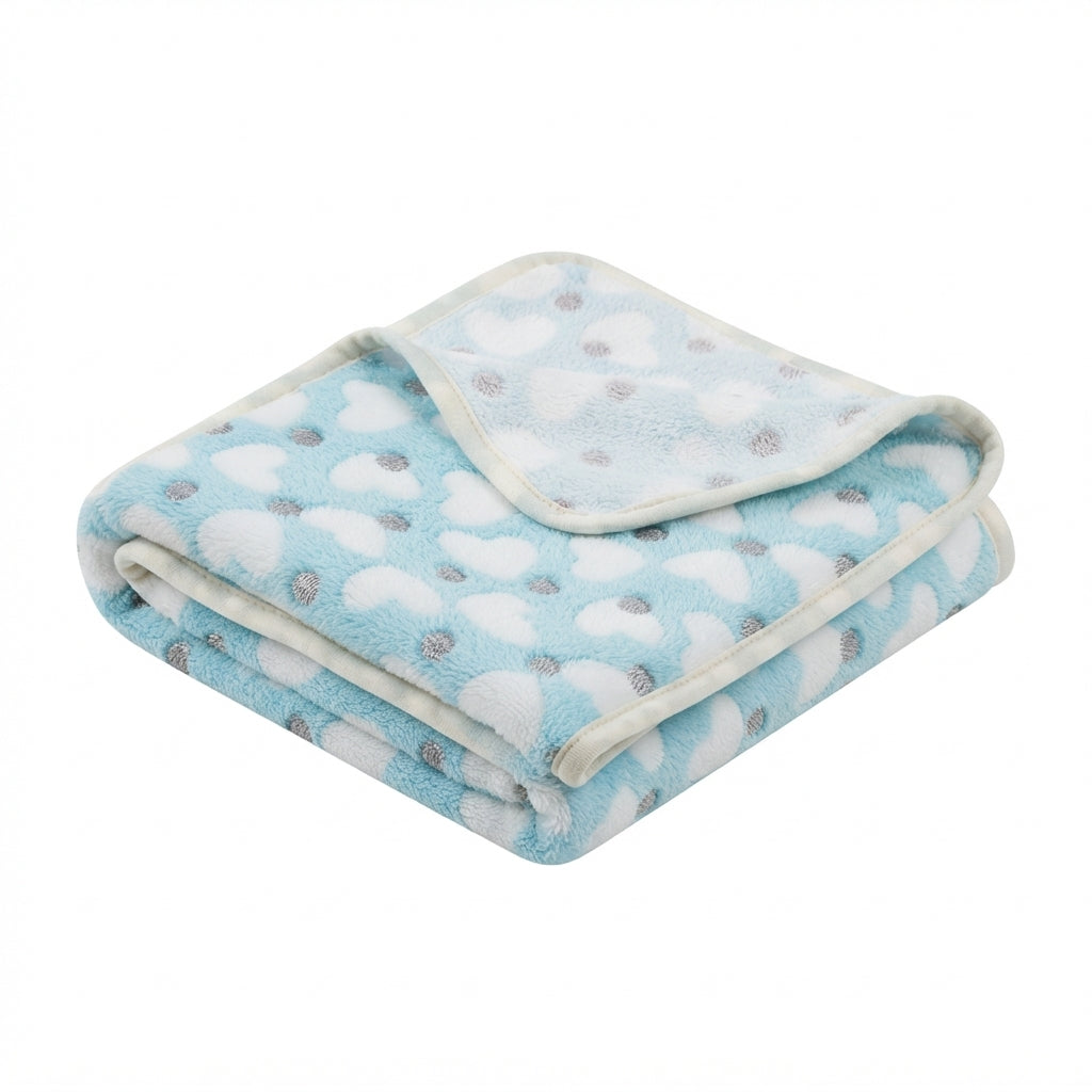 Folded pale blue fleece blanket with white hearts, grey dots and a cream bound edge