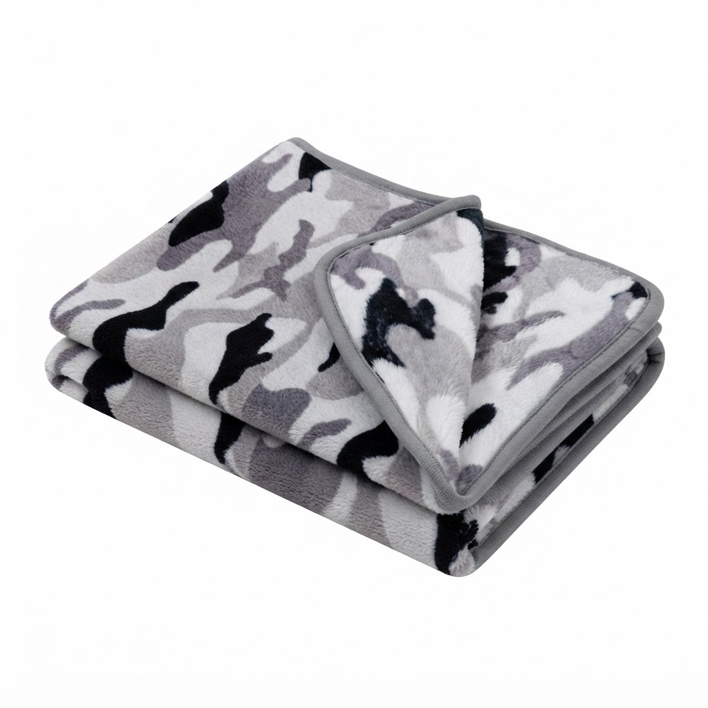 Folded fleece blanket in grey camouflage, with black, white and grey patches and a grey edge