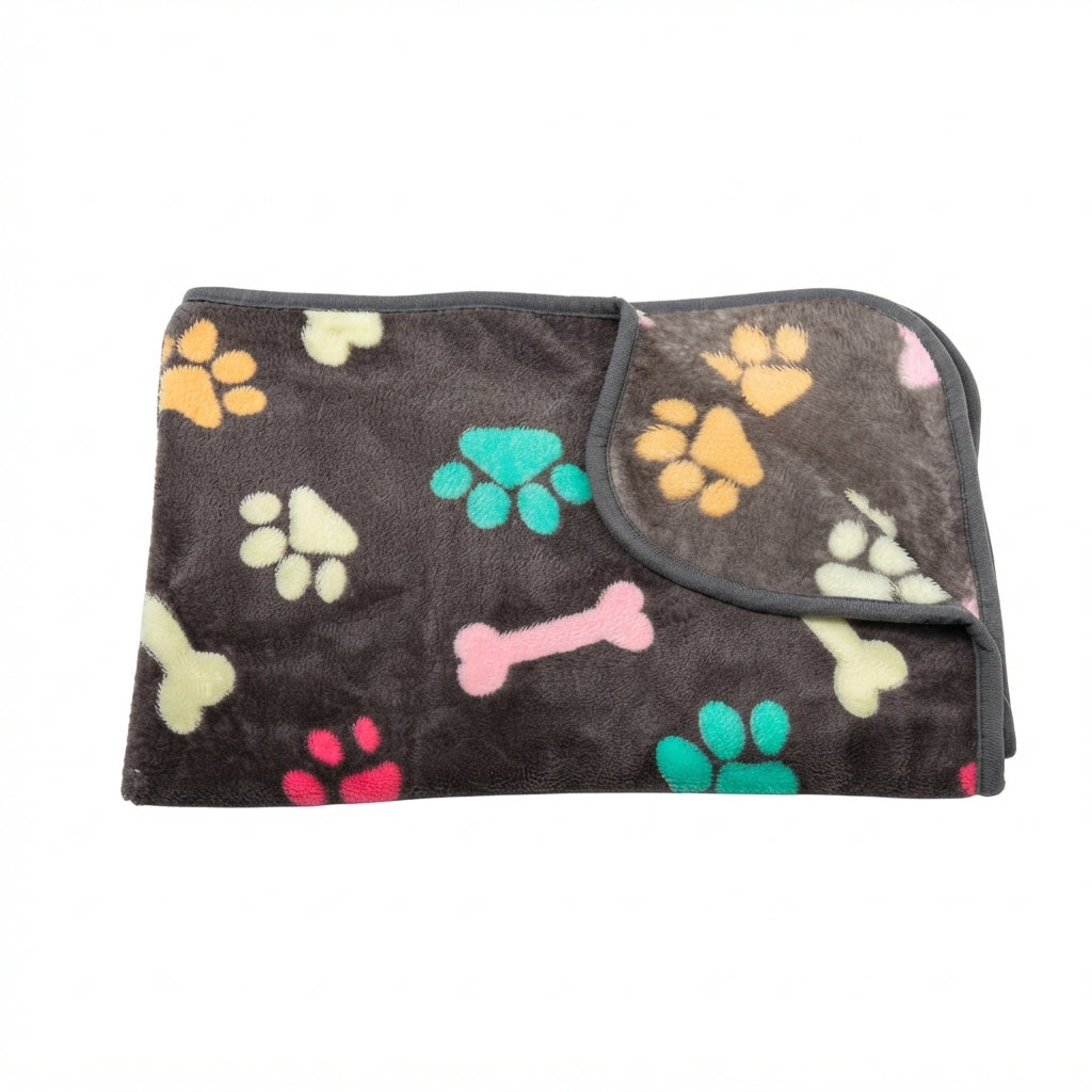 Folded charcoal grey fleece blanket with colourful paw prints and bones in yellow, teal, pink and cream