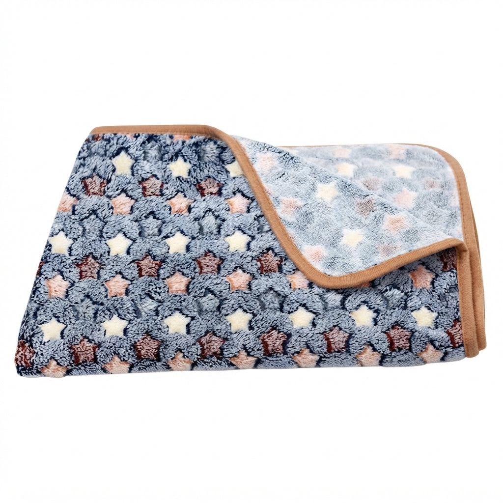 Folded navy fleece blanket with small cream, peach and brown stars and a tan bound edge