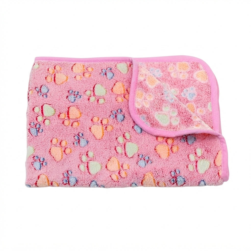 Folded rose red footprint coral fleece blanket, a mid pink with orange, green and blue paw prints