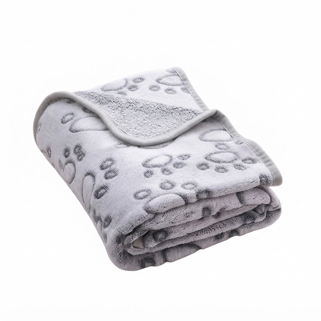 Dog bedding blanket in grey footprint coral fleece, light grey with embossed outline paw prints, folded