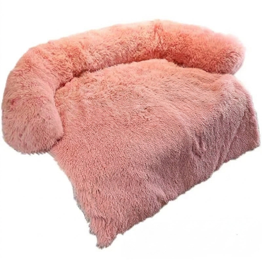 Dog couch bed in dusty pink shaggy plush, with a padded bolster and a long front flap