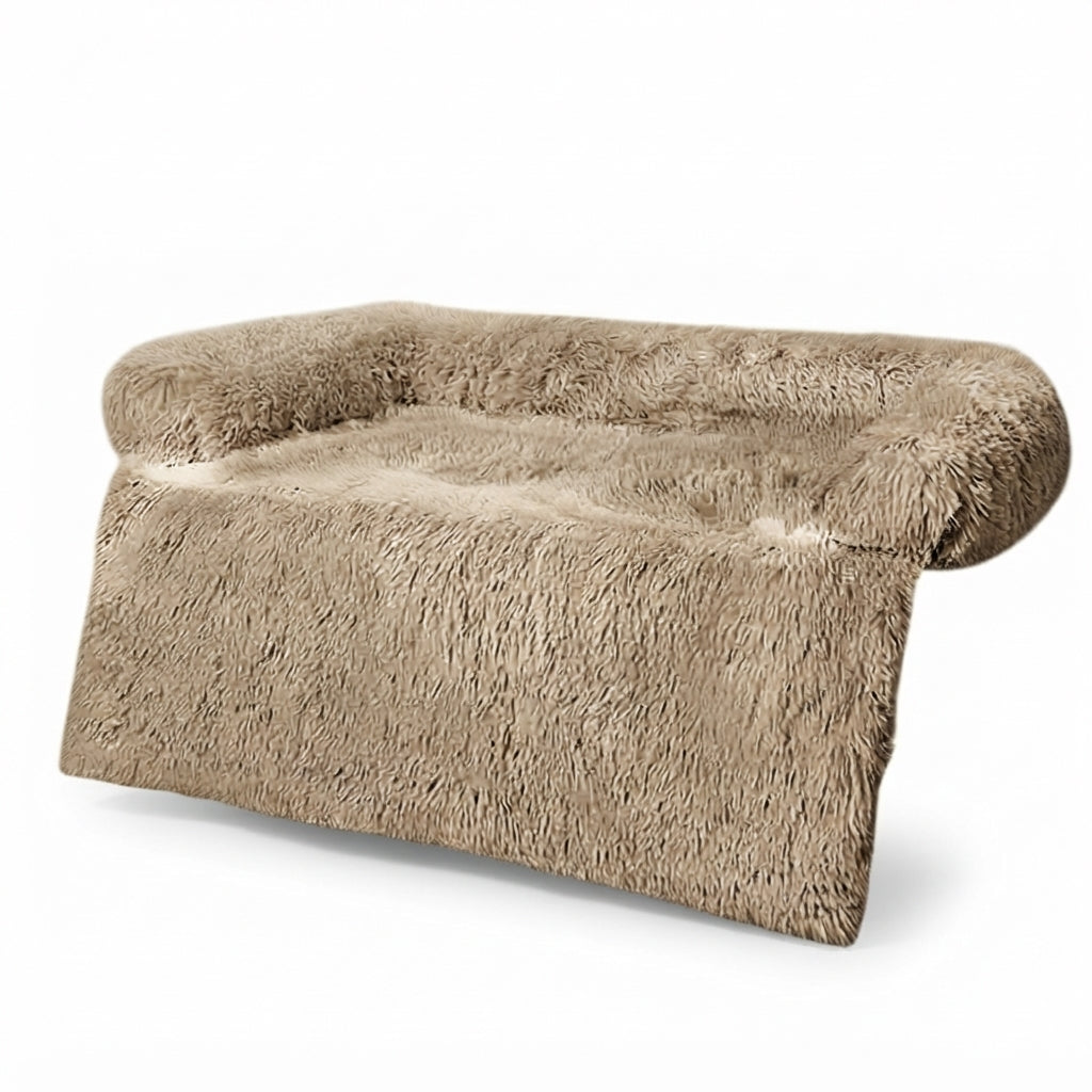 Dog couch bed in frosted caramel shaggy plush, a light taupe brown with pale tips, bolster and front flap