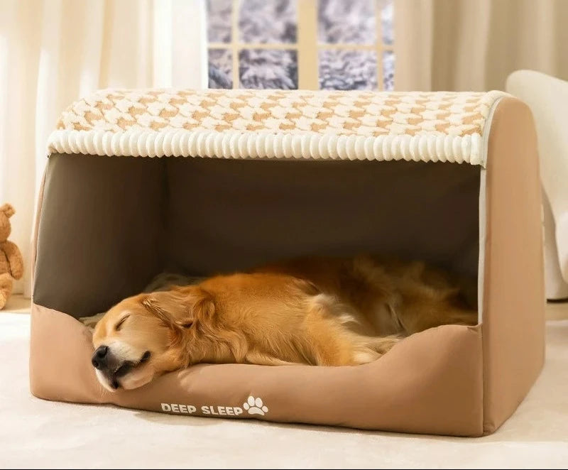 Golden retriever asleep inside a light brown dog den bed with a houndstooth roof, in a room with a teddy bear
