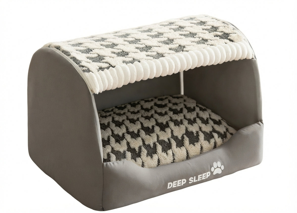 Semi-closed dog den bed in grey with a cream and grey houndstooth roof and cushion, seen at an angle