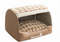 Semi-closed dog den bed in tea brown with a cream and brown houndstooth roof and cushion, seen at an angle