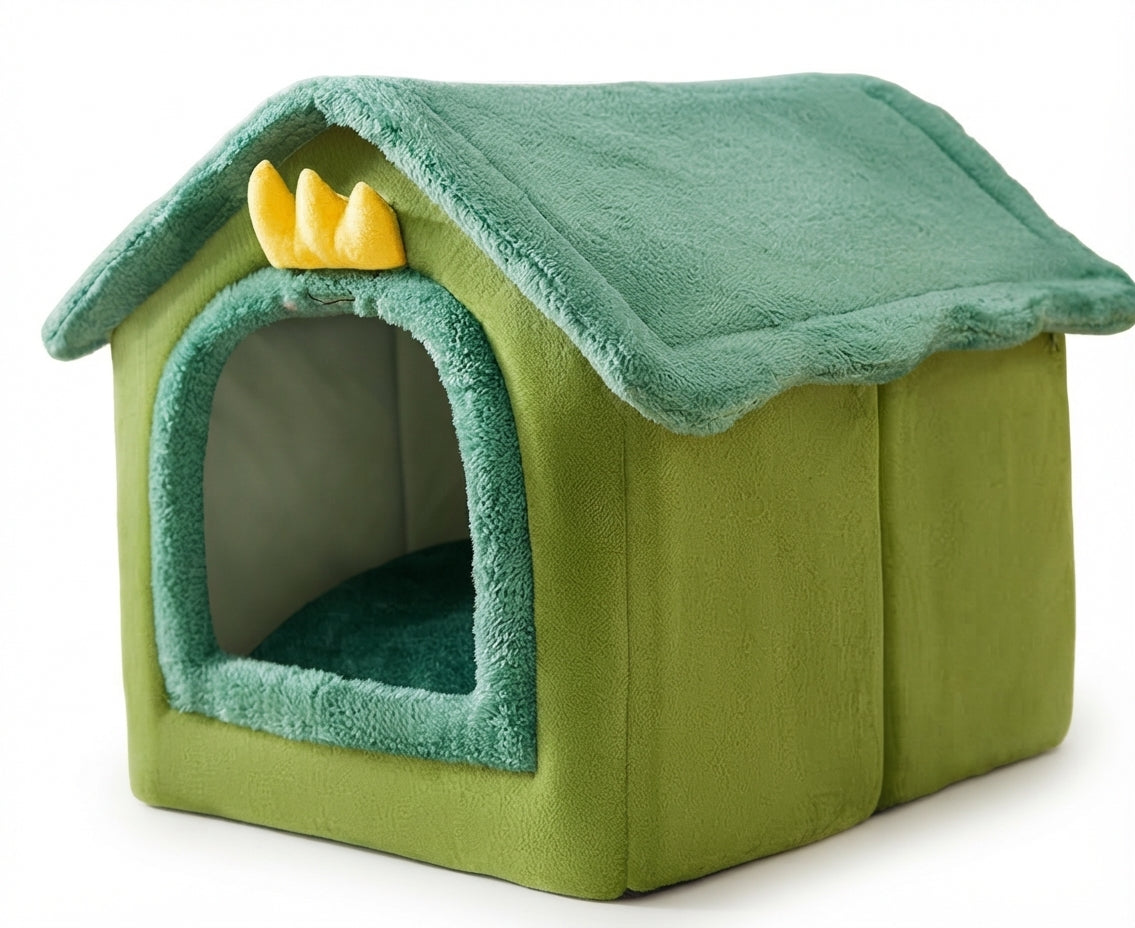 House-shaped dog bed in green with a dark green plush roof and door trim and a yellow felt crown above the door