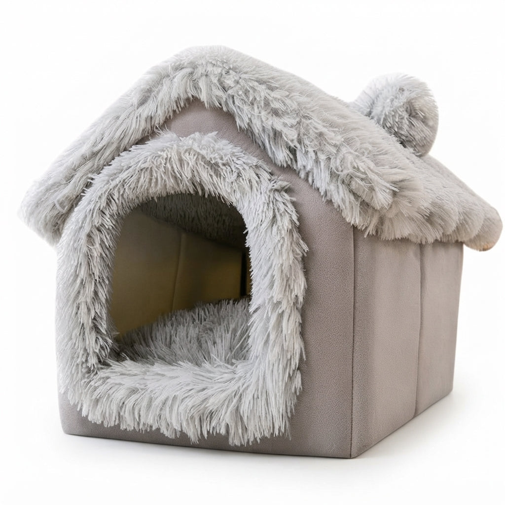House-shaped dog bed in grey with a shaggy long-plush roof and door trim and a round pompom ear