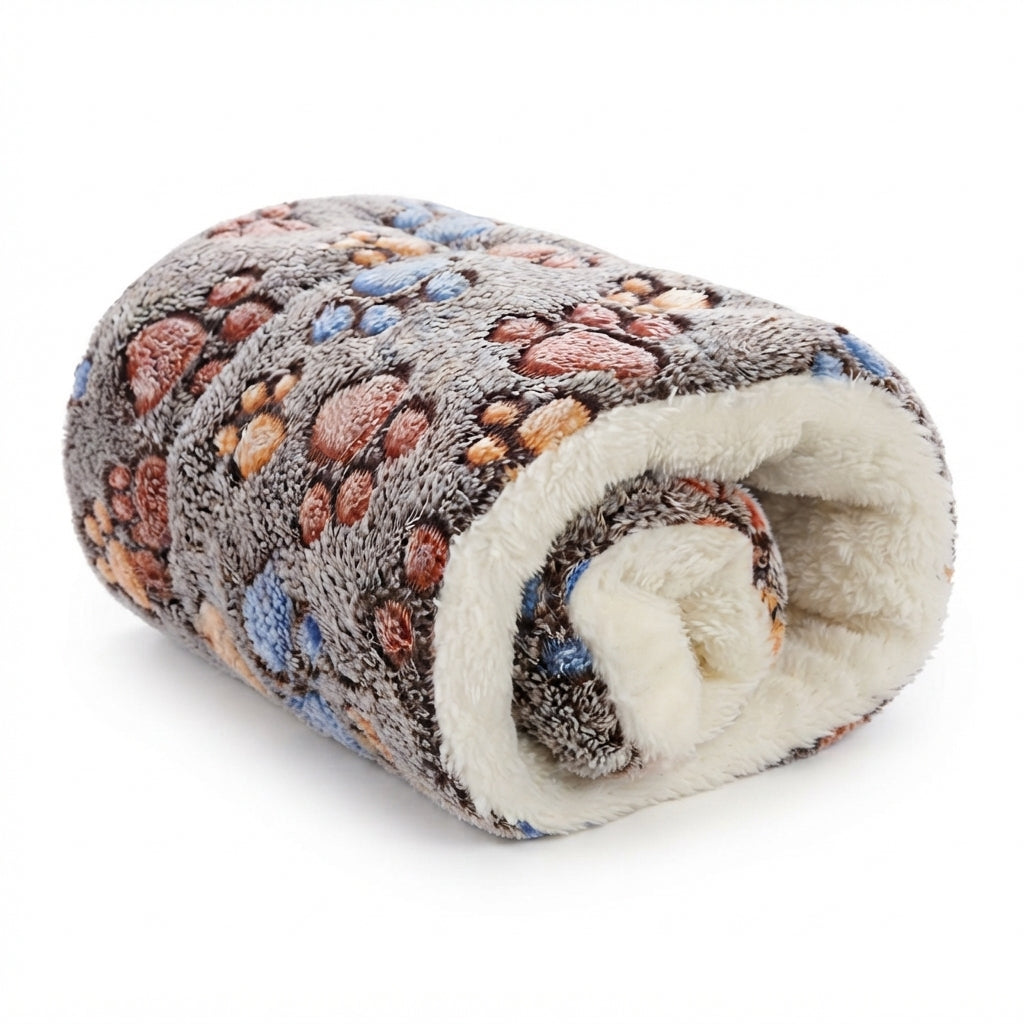 Dog pillow bed in coffee paw print flannel, rolled up to show the cream fleece underside, with brown, orange and blue paws