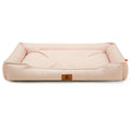 Dog settee bed in pale pink with cream piping, low bolster sides and a padded base
