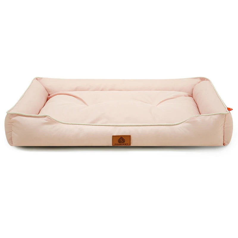 Dog settee bed in pale pink with cream piping, low bolster sides and a padded base