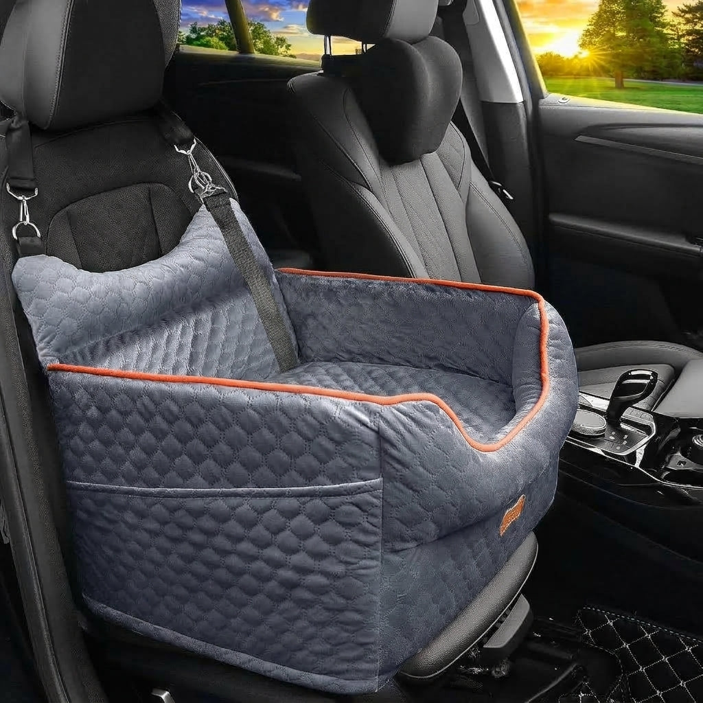 Grey quilted elevated car bed with orange piping and a front pocket, strapped to a black car seat