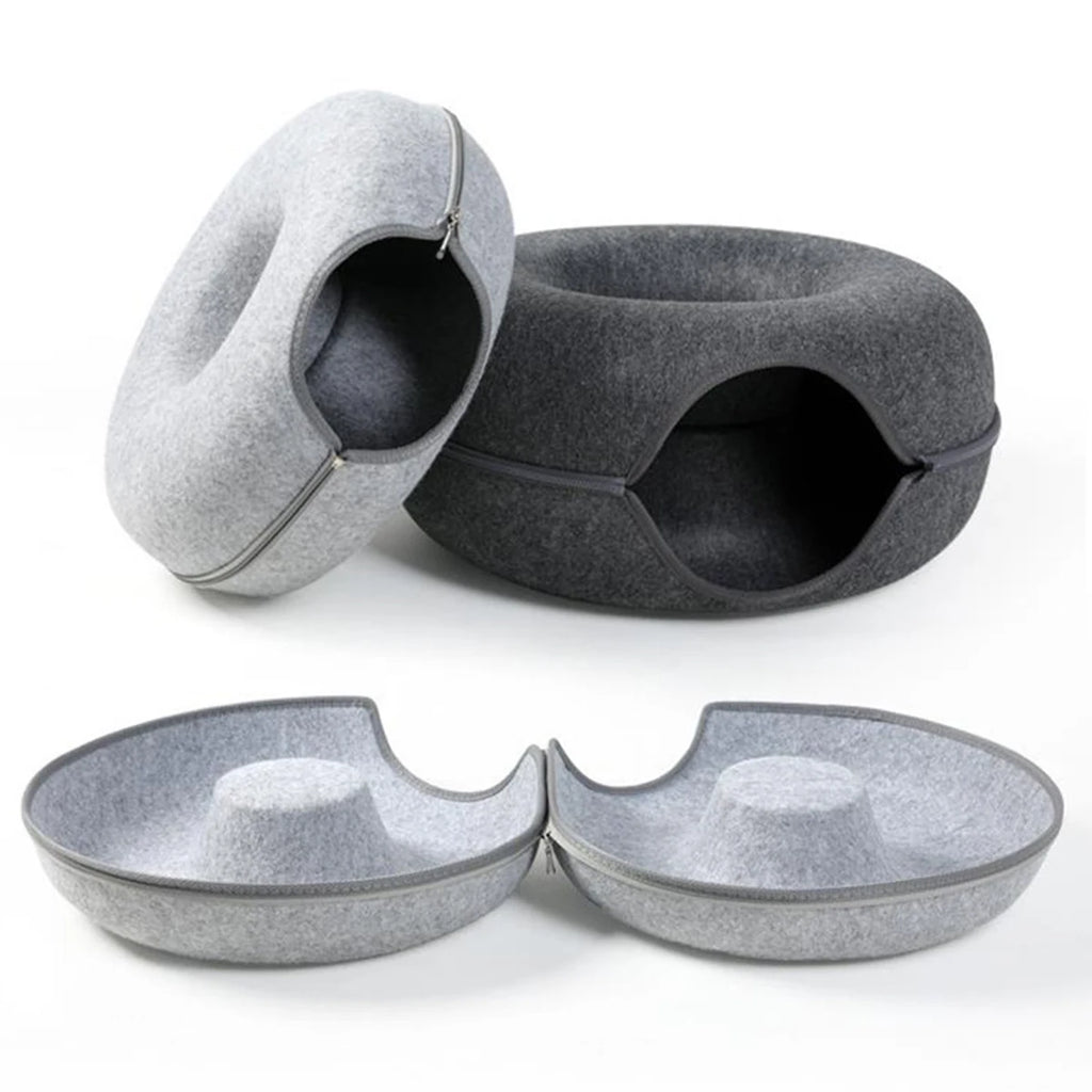 Light grey and dark grey felt donut cat beds, with a light grey one unzipped into two bowl-shaped halves in front