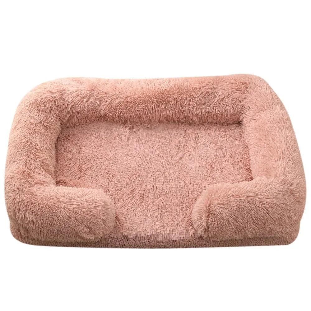 Fluffy dog bed in dusty pink shaggy plush with bolsters round the back and sides