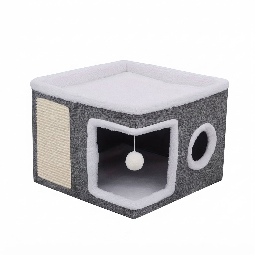 Foldable cat house in grey linen-look fabric with a white fleece top, a sisal scratch panel, a porthole and a hanging pompom