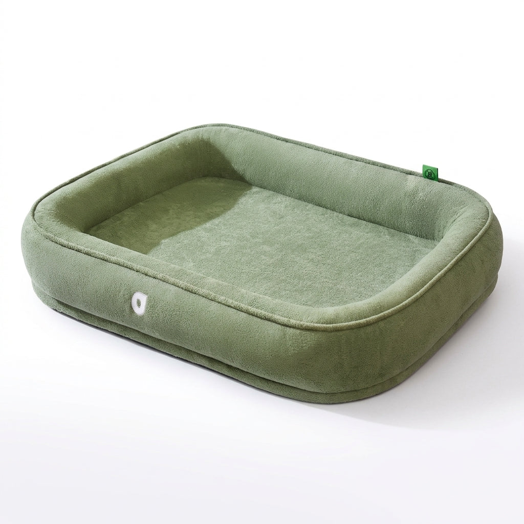 High sided dog bed in sage green plush, a rectangular bed with a thick bolster rim all round and a flat base