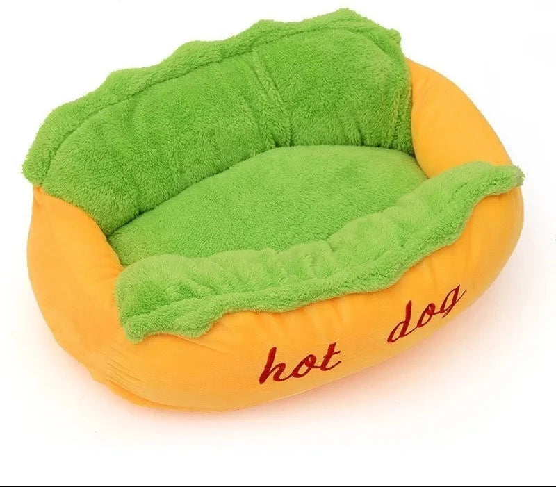 Hot dog pet bed with the green cushion in place, a yellow-orange bun base with hot dog stitched in red