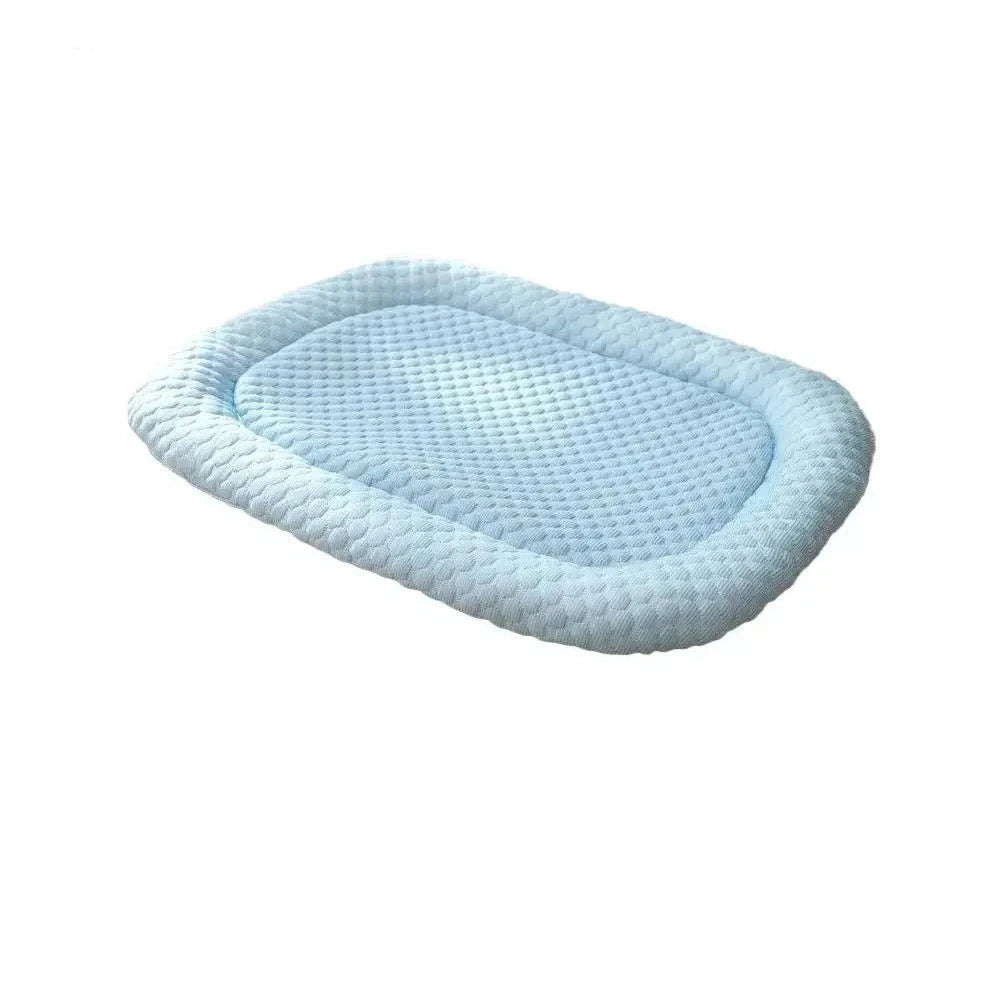 Ice silk cool bed for dogs in light blue, an oval mat with a padded bolster and a quilted textured top