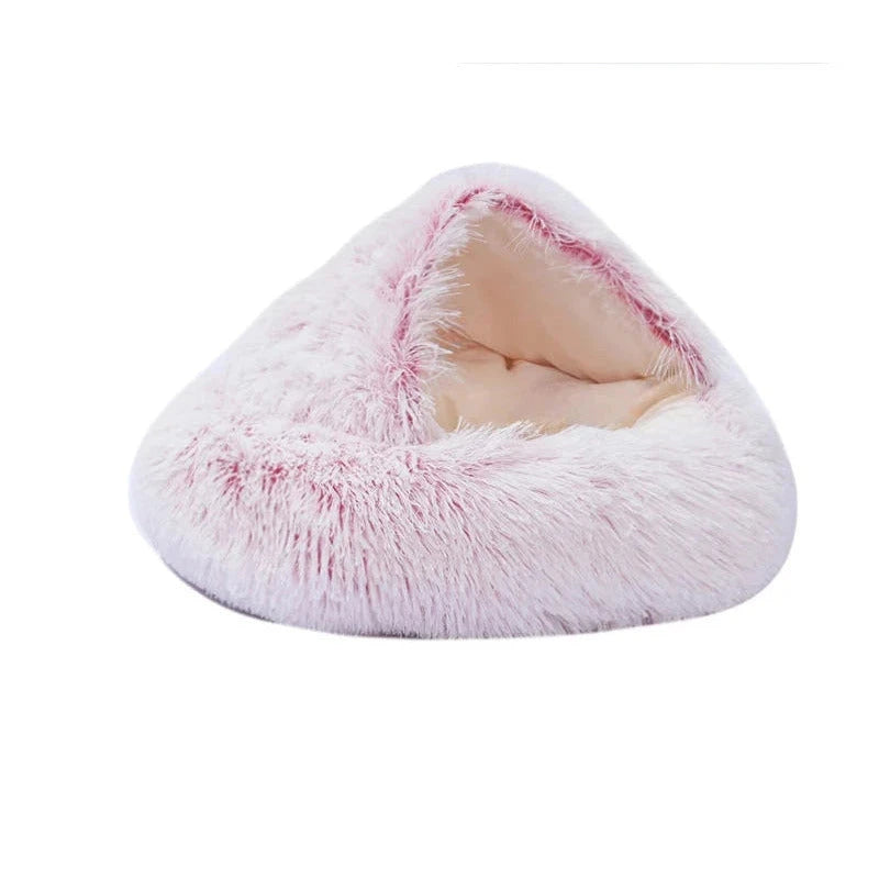Igloo dog bed in pink, short plush: a round hooded bed with shaggy white-tipped pink fur and a smooth cream lining